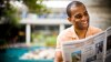 Student reading newspaper